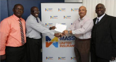 In picture, Branch Manager Lindel Harlequin gives the sponsorship cheque to Lusignan Golf Club President Oncar Ramroop. Looking on are (at left) Massy United Claims Officer Vibert Austin, and (at right) Golf Club PRO, Guy Griffith.