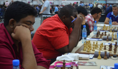 Taffin Khan, Ronuel Greenidge, Haifeng Su, partly hidden and Roberto Neto are all deep in concentration during yesterday’s match against Bermuda. (Photos courtesy of Irshad Mohamed) 