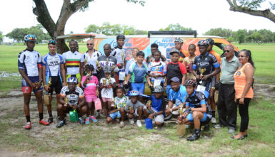 The programme’s prize winners posing with their spoils after yesterday’s fixture at the National Park. (Orlando Charles photo)