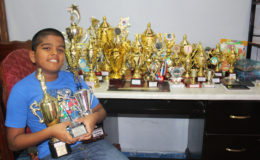  Yovendra ‘Nyan’ Singh poses with his 28 trophies