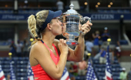 NEW QUEEN OF THE COURTS! Germany’s Angelique Kerber kisses the silverware after her U.S. Open women’s singles final triumph against Karolina Pliskova yesterday. 