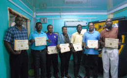 The seven lecturers who are now certified to operate the simulators.
