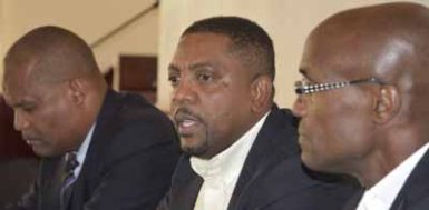 Press Briefing following the Board of Directors meeting in Roseau, Dominica – President Dave Cameron (middle) is supported by VP HE Emmanuel Nanthan (left) and head of Cricket Committee, Julian Charles (right)