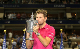 SEALED WITH A KISS? Stanislaus Wawrinka with the U.S. Open trophy after his upset win over defending champion Novak Djokovic yesterday.