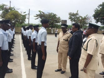 Minister of Public Security Khemraj Ramjattan (second from right) inspecting the new Prison Officers.
