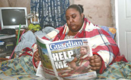 Marissa Nelson, who suffers from lymphoedema, reads the Guardian's article which highlighted her plight.