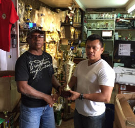 A Trophy Stall’s representative, presented the championship trophy to GAPF’S Tyrone Eusibio yesterday ahead of tomorrow’s fixture. 