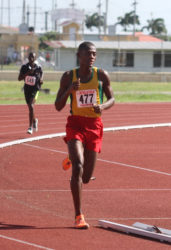 Odwin Tudor striding to victory in the boy’s 5000m. (Orlando Charles photo) 