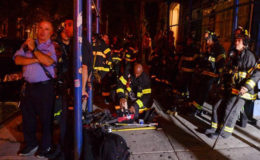 New York City firefighters stand near the site of an explosion in the Chelsea neighborhood of Manhattan, New York, U.S. September 17, 2016. REUTERS/Rashid Umar Abbasi
