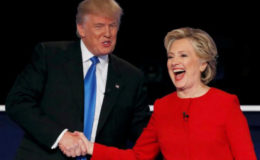 Donald Trump shakes hands with Hillary Clinton at the conclusion of their first presidential debate. (Reuters/Mike Segar)