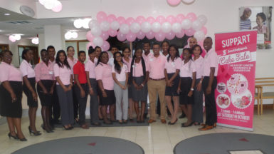 Staff of Scotiabank’s Robb Street Branch at the launch of the cake sale. 