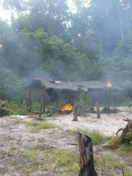 One of the camps after it was set on fire (Police photo)