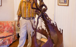 Sculptor Winslow Craig standing beside one of his creations at Moray House (Photo by Michael C. Lam)