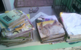  A pile of damaged books belonging to a resident of Second Avenue, Bartica.