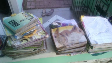  A pile of damaged books belonging to a resident of Second Avenue, Bartica.