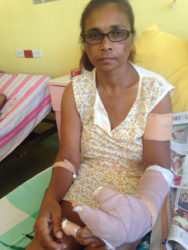 The wounded Savitree Sankumar in her hospital bed yesterday 