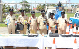 Traffic Chief Deon Moore (third from right) and other senior police officers from the Traffic department displaying the equipment.