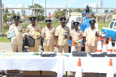 Traffic Chief Deon Moore (third from right) and other senior police officers from the Traffic department displaying the equipment.