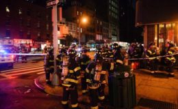 
New York City firefighters stand near the site of an explosion in the Chelsea neighborhood of Manhattan, New York, U.S. September 17, 2016. REUTERS/Rashid Umar Abbasi
