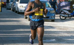 Cleveland ‘Little Kenyan’ Forde crossing the finish line all alone to take the top honors of the Courts 10K Run yesterday.