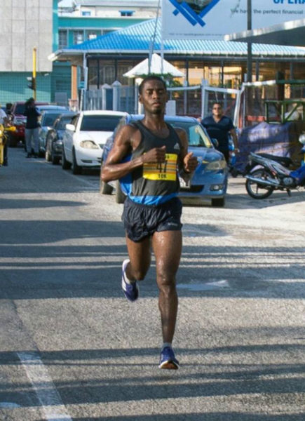 Cleveland ‘Little Kenyan’ Forde crossing the finish line all alone to take the top honors of the Courts 10K Run yesterday.