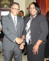 President of the Law Association Reginald Armour, left, greets Industrial Court president Deborah Thomas-Felix during the opening of the Industrial Court 