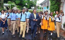 Prime Minister, Moses Nagamootoo (centre) showed the visiting students around the residence (GINA photo)