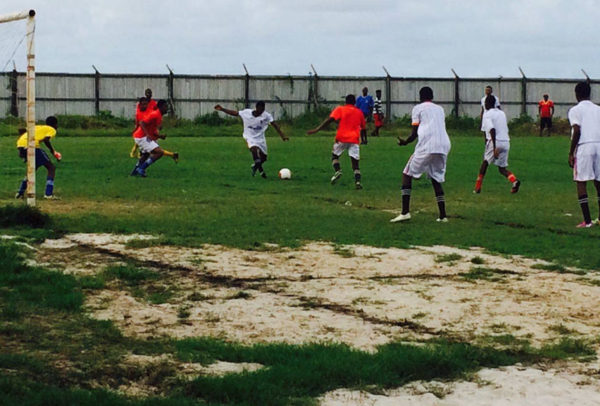 Daniel Floy (centre) of Uitvlugt Secondary in the process of unleashing a powerful goal bound strike during his team’s win over Vreed-en-Hoop Secondary in the Secondary School final of the Ministry of Social Protection West Demerara football championships Saturday.