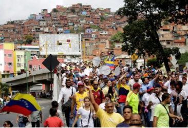 Opposition supporters take part in a rally to demand a referendum to remove Venezuela's President Nicolas Maduro in Caracas, Venezuela, September 1, 2016. REUTERS/Marco Bello