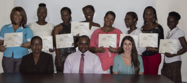 The graduates of The Savings Group Training Initiative along with the project manager, facilitator and the CEO of the Volunteer Youth Corps. Back row (left to right)- Muna Nur, Osmine Williams, Tricia Wharton, Latanna Brandon, Melissa London, Joyann Blair, Antoinette Leslie, Alyce Cameron. Front row (left to right) - Goldie Scott, CEO of Volunteer Youth Corps, Eon Stephens, Facilitator of the project and Jelena Ivic, Women's Entrepreneur Advisor (Cuso International Volunteer) 