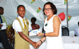 Top East Coast student, Aletha Joseph receives her award from First Lady,  Sandra Granger.  (Ministry of the Presidency photo)

