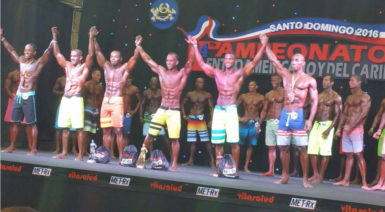  Emmerson Campbell, third from left, and the other competitor’s in the Men’s Physique category join hands at the conclusion of the event.