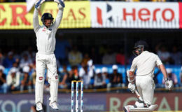 India’s Wriddhiman Saha successfully appeals for the wicket of New Zealand’s Kane Williamson. REUTERS/Danish Siddiqui