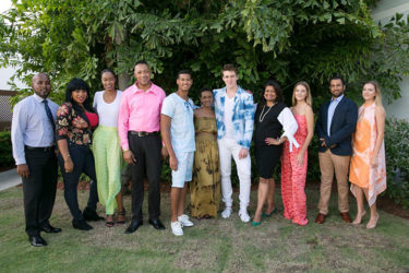 Supriya Singh-Bodden (fourth from right) and Anthony Autar (left) with the models
