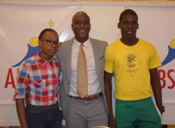  Portugal bound-Jeremy Garrett (right) and Shemika Marcus (left) posing with Alex Bunbury following the conclusion of the press conference detailing their impending trial at Sporting Lisbon of Portugal.