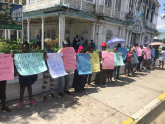 Vendors protesting yesterday in front of City Hall for City Council to have a formal meeting with the Guyana Market Vendors Union.   