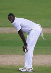 Fast bowler and West Indies Captain Jason Holder offers a wry grin as Pakistan pile on the runs during the second day of the day/night opening Test yesterday. (Photo courtesy WICB. 
