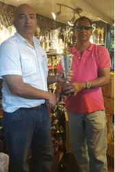 In picture President Oncar Ramroop (left) receives a trophy – the symbol of Trophy Stall’s sponsorship – from Mr. Ramesh Sunich, CEO of Trophy Stall.