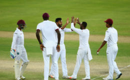 DUBAI, UNITED ARAB EMIRATES  Devendra Bishoo of the  West Indies celebrates with his teammates after dismissing Sami Aslam of Pakistan during Day Four of the First Test between Pakistan and West Indies at Dubai International Cricket Ground yesterday in Dubai, United Arab Emirates. (Photo by Francois Nel/Getty Imag
