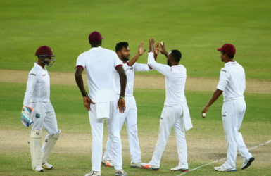 DUBAI, UNITED ARAB EMIRATES Devendra Bishoo of the West Indies celebrates with his teammates after dismissing Sami Aslam of Pakistan during Day Four of the First Test between Pakistan and West Indies at Dubai International Cricket Ground yesterday in Dubai, United Arab Emirates. (Photo by Francois Nel/Getty Imag