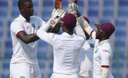West Indies captain Jason Holder (left) celebrates the wicket of Sohail Khan during his three-wicket haul on the second day of the second Test against Pakistan. (Photo courtesy WICB Media)