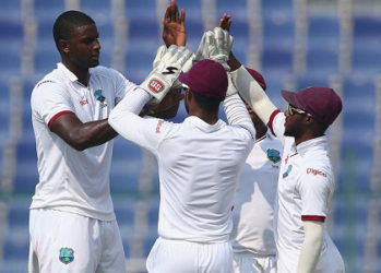West Indies captain Jason Holder (left) celebrates the wicket of Sohail Khan during his three-wicket haul on the second day of the second Test against Pakistan. (Photo courtesy WICB Media)  
