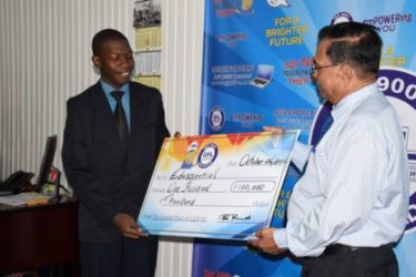 Human Resource, Executive Director of GPL, Bal Parsaud presenting cheque of $100,000 to Representative for Edussential Company, Mark Stevens (right)