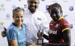 A beaming WICB president Dave Cameron, poses with Players-of-the-Series England’s Alex Hartley and West Indies’ Stafanie Taylor, following the five-match ODI series recently. (Photo courtesy WICB Media)