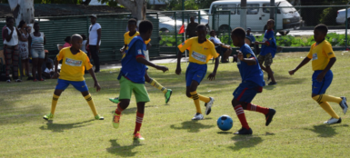 Flashback-Part of the group stage action in the 5th annual Court’s Pee-Wee Primary Schools football Championship at the Thirst Park ground 