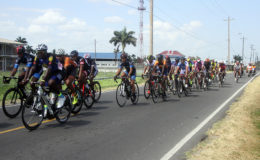The peloton on the go in yesterday’s fifth annual Digicel Cancer Awareness road race. (Orlando Charles photo)