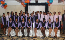 Republic Bank’s newest batch of apprentices flanked by Minister within the Ministry of Social Protection Keith Scott (left) and Managing Director of Republic Bank Guyana Limited Richard Sammy (right)