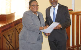 Chief Magistrate Ann McLennan and Commissioner Gary Best at his swearing in ceremony yesterday. (Photo by Keno George)