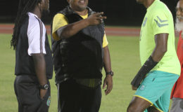 PLANNING STRATEGY: Head Coach Jamaal Shabazz, assistant coach Wayne Dover and skipper Christopher Nurse appear to be plotting Suriname’s downfall. (Orlando Charles photo)