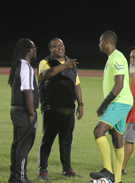PLANNING STRATEGY: Head Coach Jamaal Shabazz, assistant coach Wayne Dover and skipper Christopher Nurse appear to be plotting Suriname’s downfall. (Orlando Charles photo)